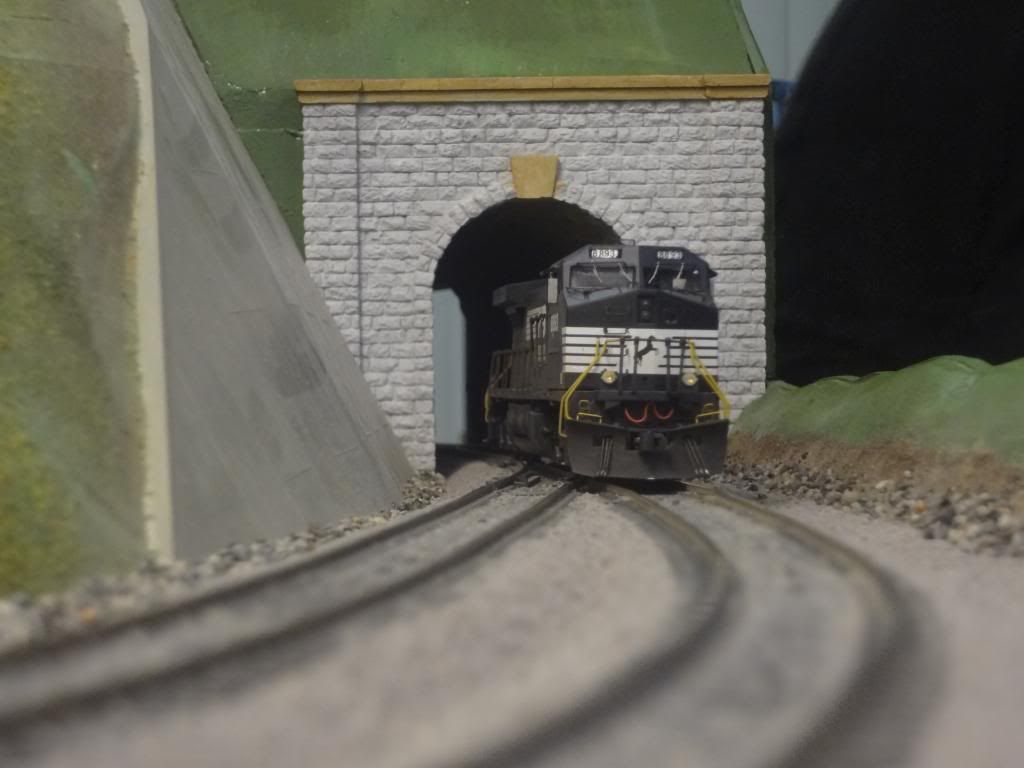 A more modern piece of power emerging from the tunnel on the main line